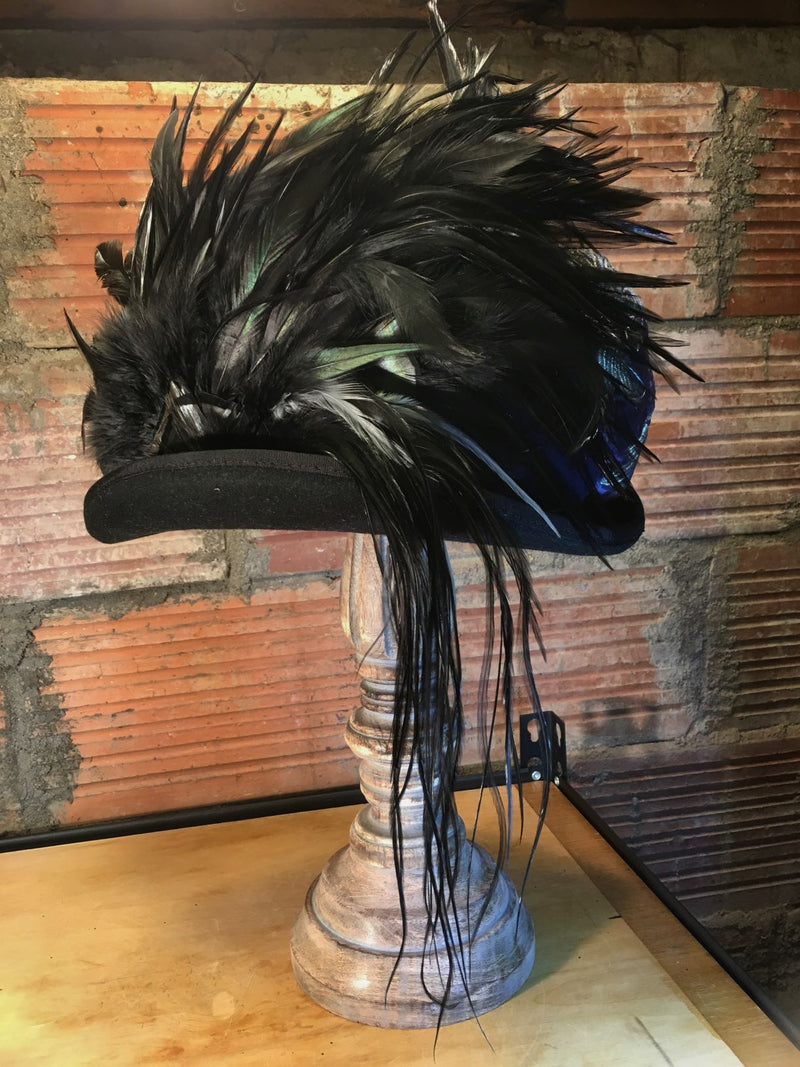 Wearable art handcrafted one feather at a time.