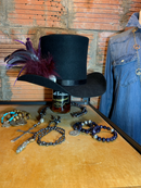The large sterling silver conch is perfect with the feathers! Make a statement with this top hat!