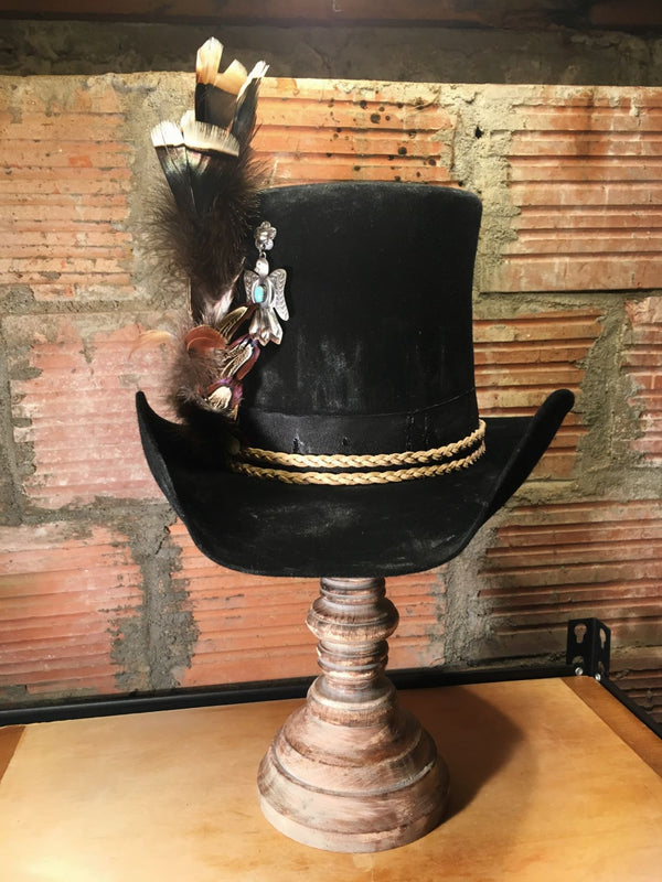 Sterling silver and turquoise Thunderbird helps make the statement. Adorned with Dusty's signature feather embellishment, this top hat is a piece of art.  