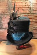 I love to use vintage costume jewelry to create style and character.  This top hat may be our standard base but everything about it is custom and will not be seen again.