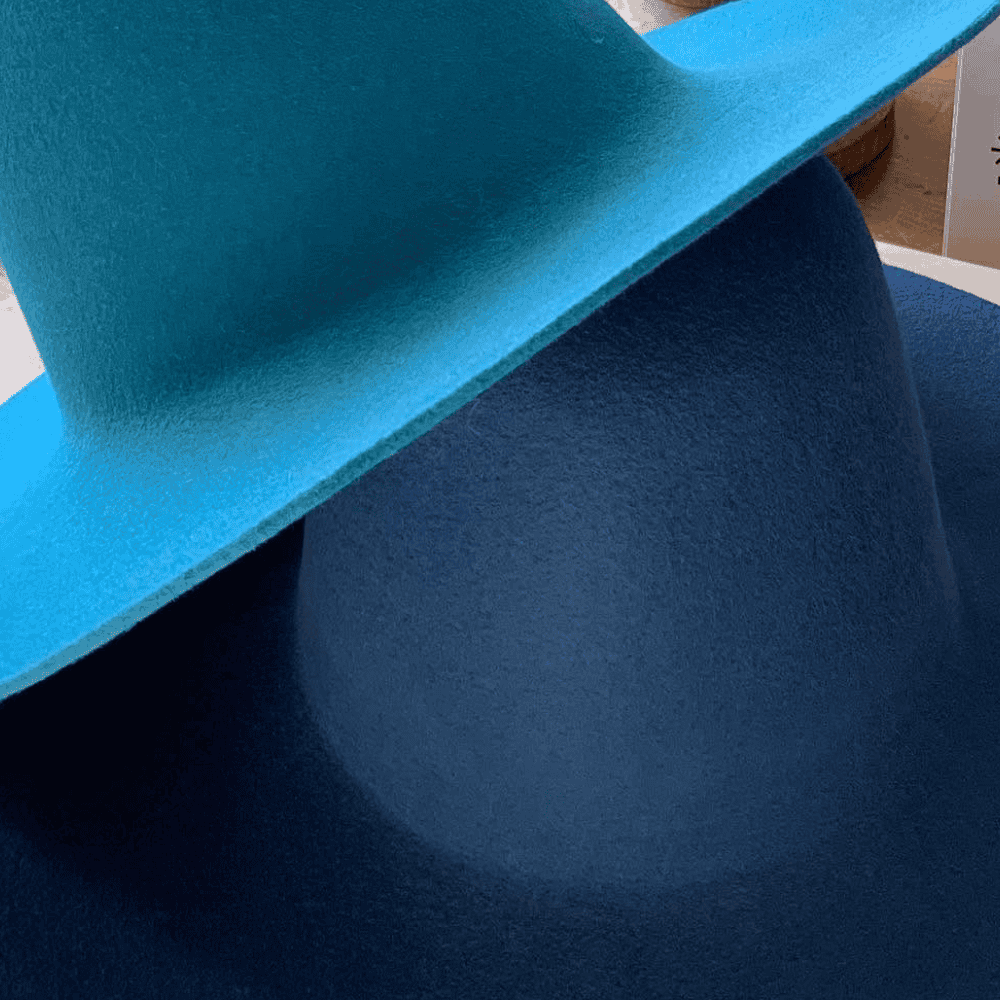 close up view of custom hat blanks stacked on top of one another