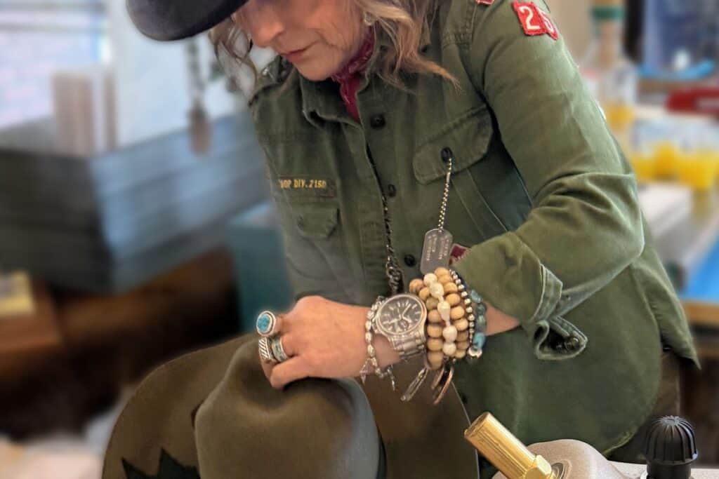 Hat maker using steam to shape custom hat