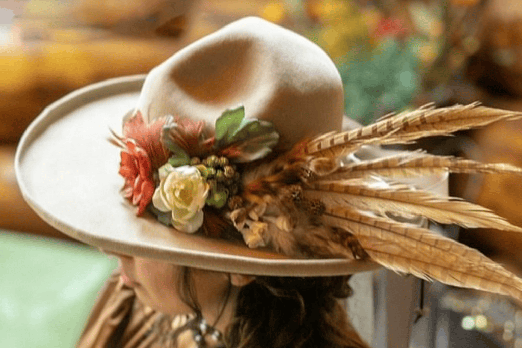Close view of feather detail on a custom hat